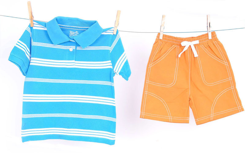 Blue striped rugby, $6.50 at Just Ducky; orange swim trunks, $29 at Little Purls