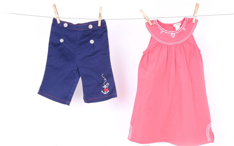 Navy capris (part of a two-piece set), $10.50 at Luca; coral sundress, $48 at Little Purls