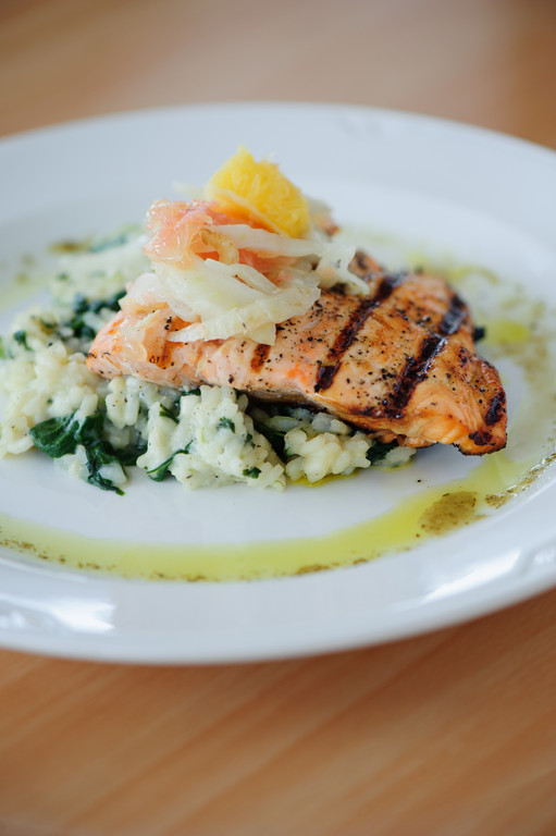 Grilled Atlantic salmon, citrus fennel salad and spinach risotto with a lemon thyme dressing