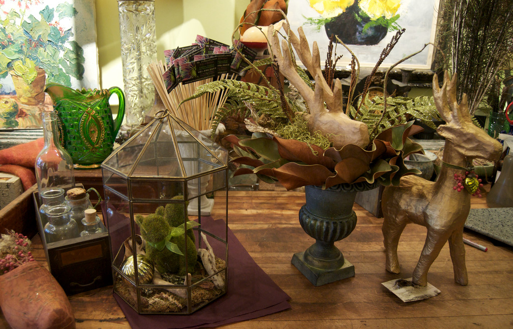 The vintage industrial bakers island/ work station is always changing it’s look. This flocked squirrel and vintage terrarium ‘house’ is $60.