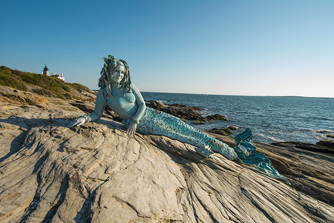 TEN31 Production's installation of a living mermaid statue at Beavertail State Park.