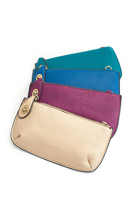 In the Clutch – Joy Susan clutch/wristlet/shoulder bag, available in 20 colors; $34 at Green Ink
Green Ink offers a fabulous selection of winter accessories: scarves, gloves, hats, cozy socks plus beautiful clothing and shoes to dance through your holidays in style!
Green Ink 89 Brown St, Wickford 401-294-6266 greeninkboutique.com