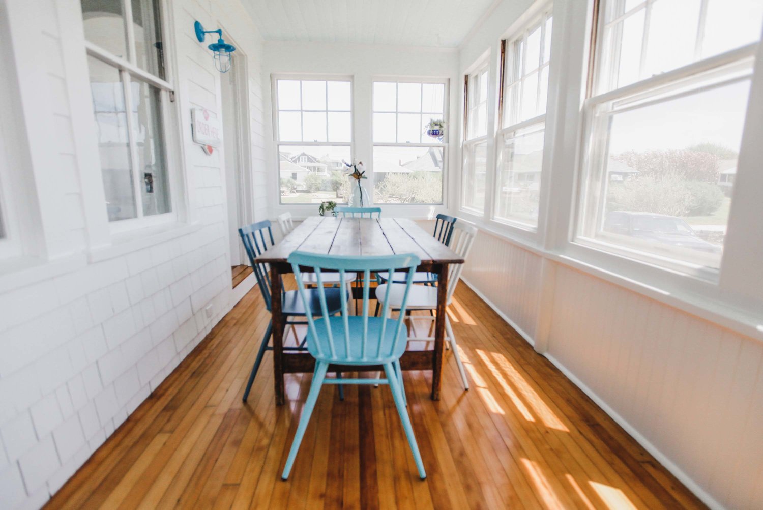 The sunporch dining area offers coastal views
