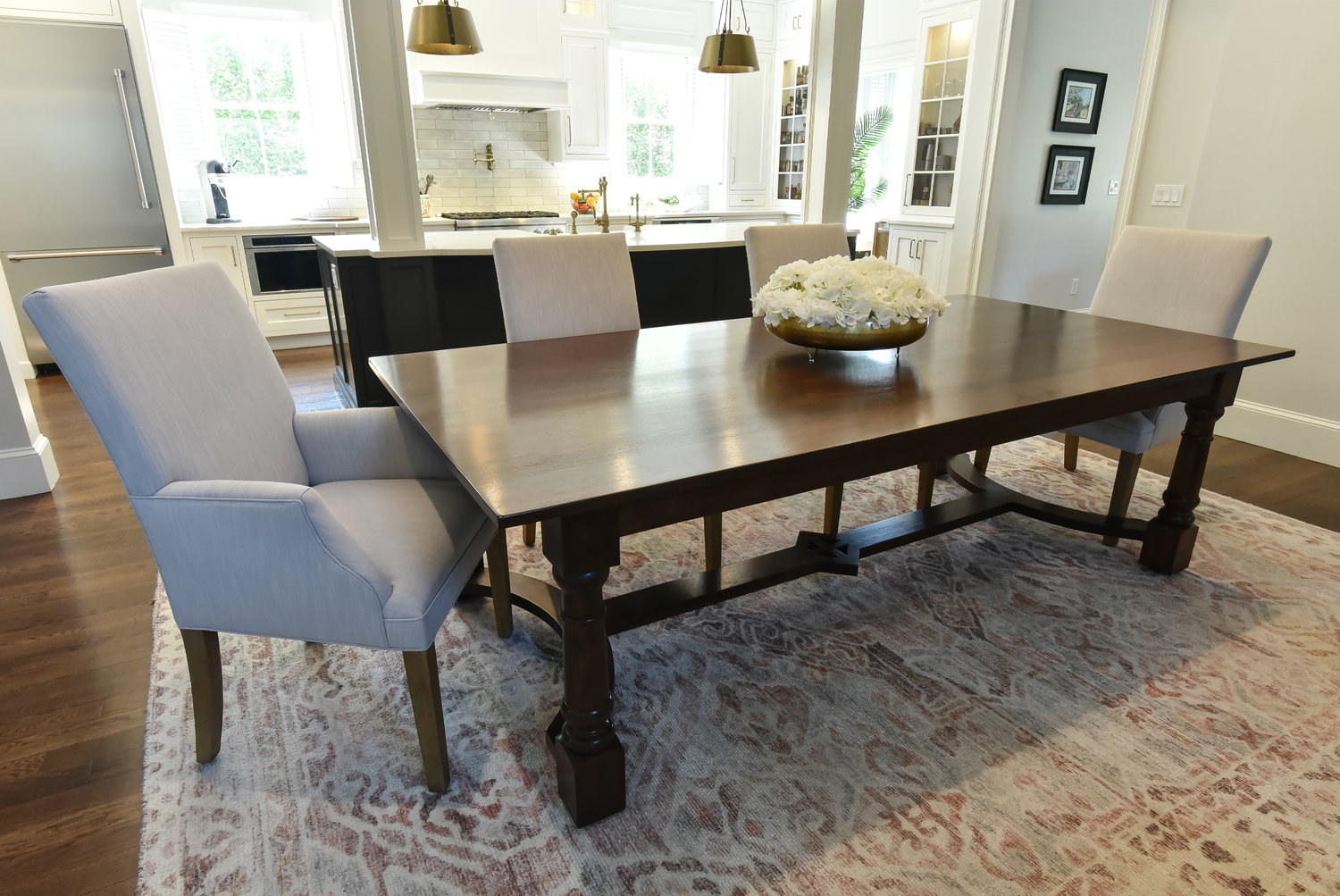 The walnut dining table was a design collaboration between Inside Style, their clients, and Matt Johnson, artisan/craftsman