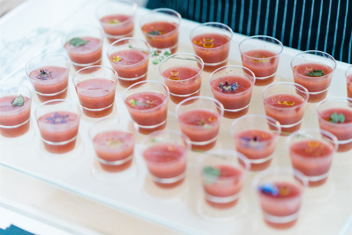 Watermelon gazpacho shooters infuse a summer cocktail hour with chill vibes and bright color