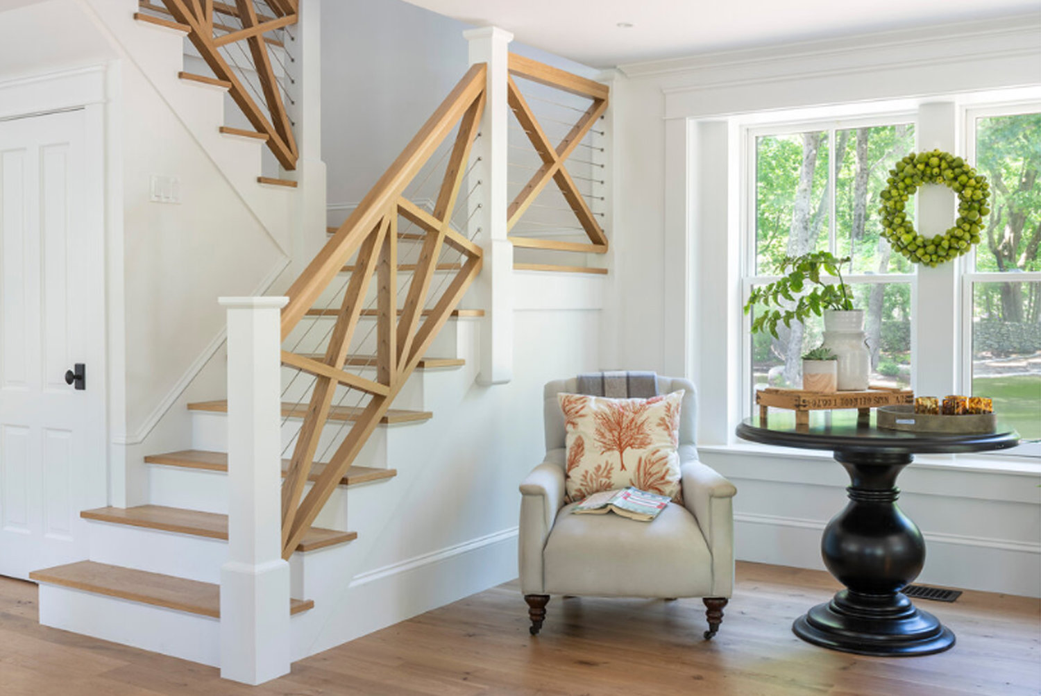 An oak cross buck design with steel cable creates a beautiful – and safe – stairway design
