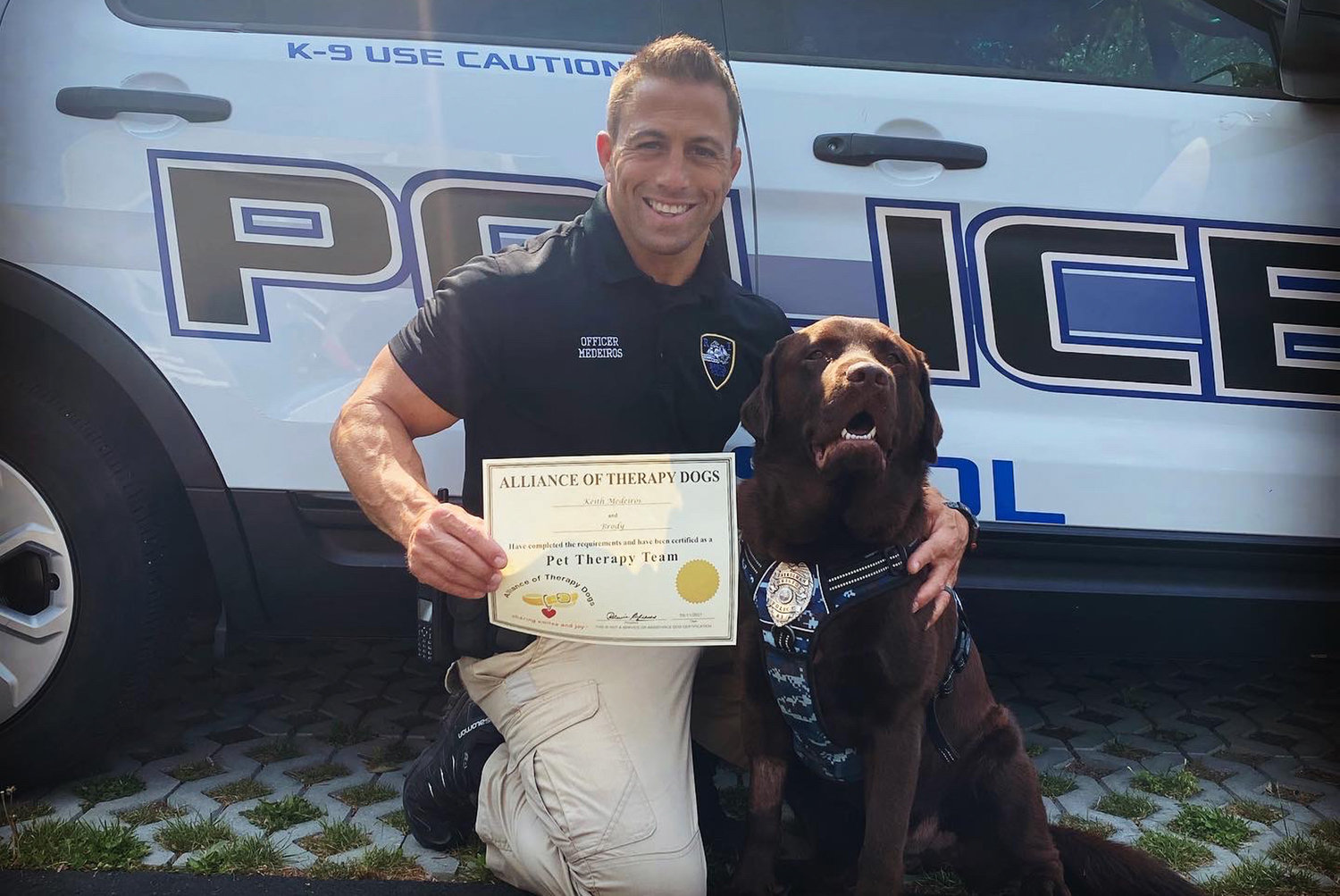 Officer Keith Medeiros with K-9 Brody reporting for duty