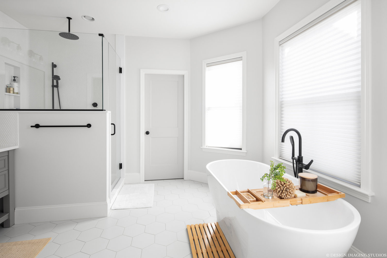 Master bathroom with pebble tiled shower and bathtub