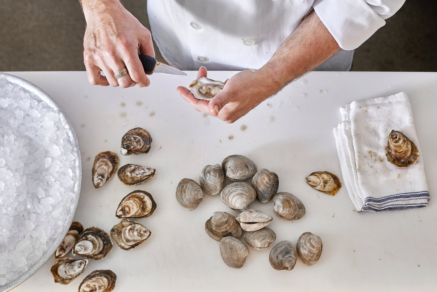 Graham demonstrates tools of the trade at Oyster Shucking 101